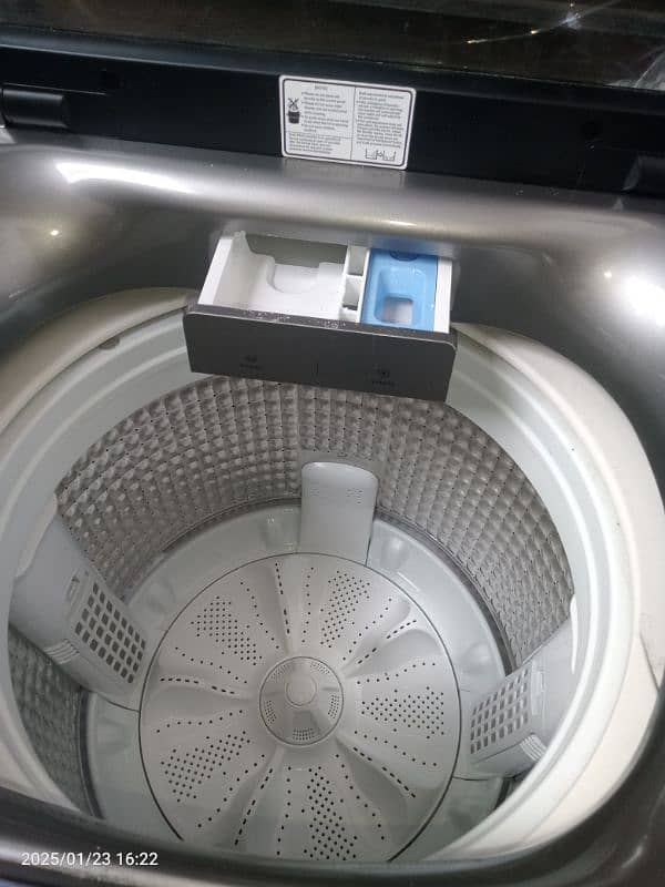 Haier fully automatic washing + dryer machine 1