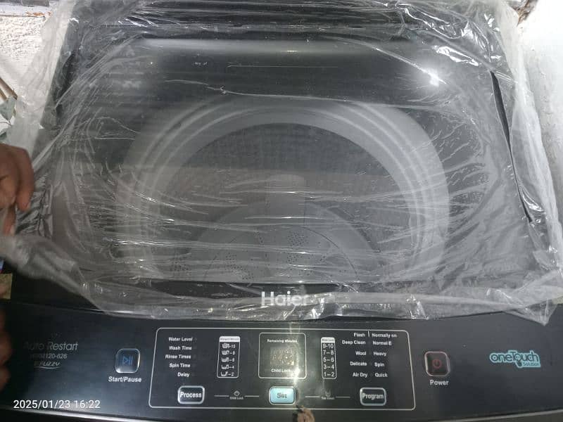 Haier fully automatic washing + dryer machine 3