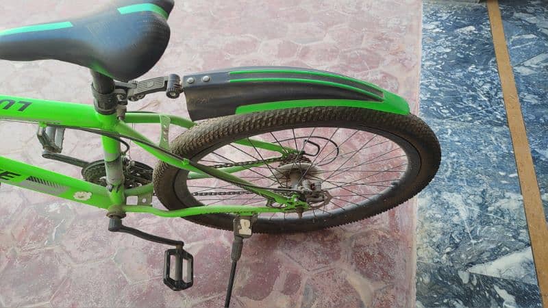 Green Lucky Bike a mountain bicycle with gears 3