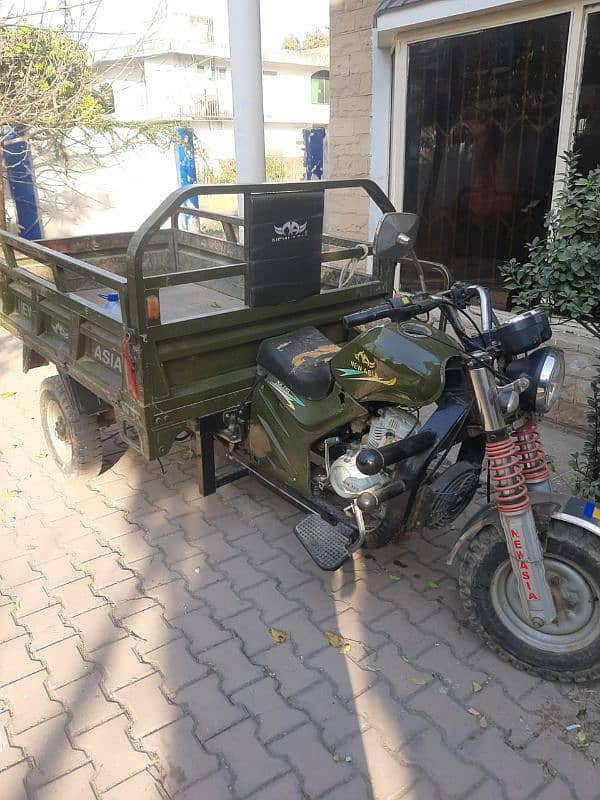 The lorder rickshaw in green colour location:khan house,6 Road A block 4