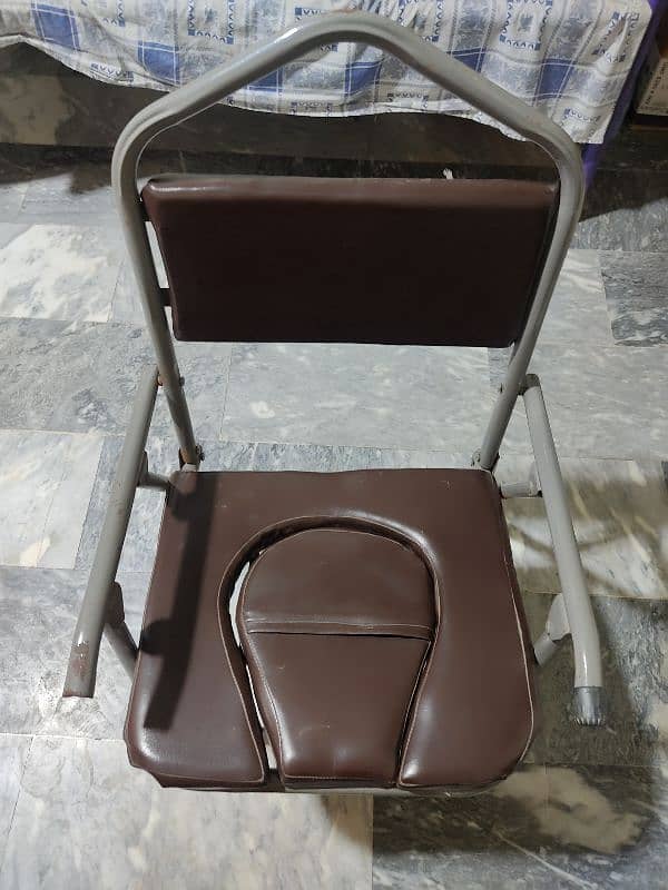 foldable commode chair toilet chair for sale in multan 0