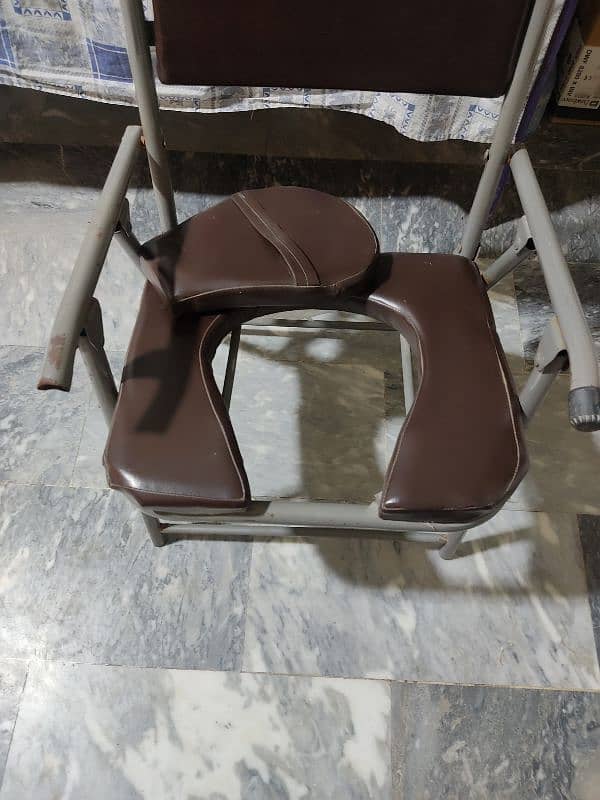 foldable commode chair toilet chair for sale in multan 1