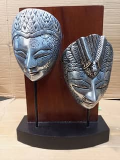 silver mask wooden stand art