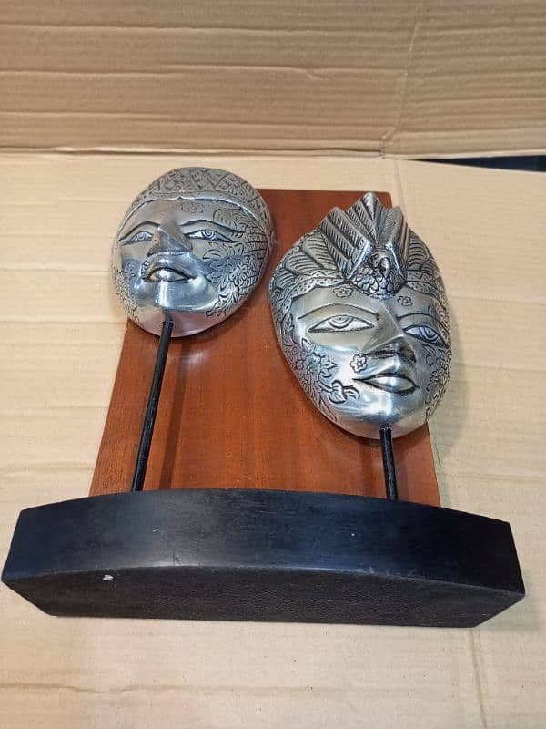 silver mask wooden stand art 3