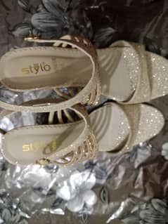 Branded silver heels golden straps