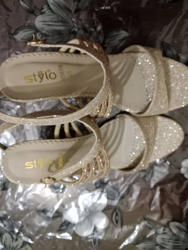 Branded silver heels golden straps 0