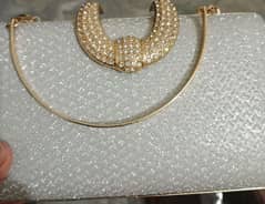 Branded silver clutch