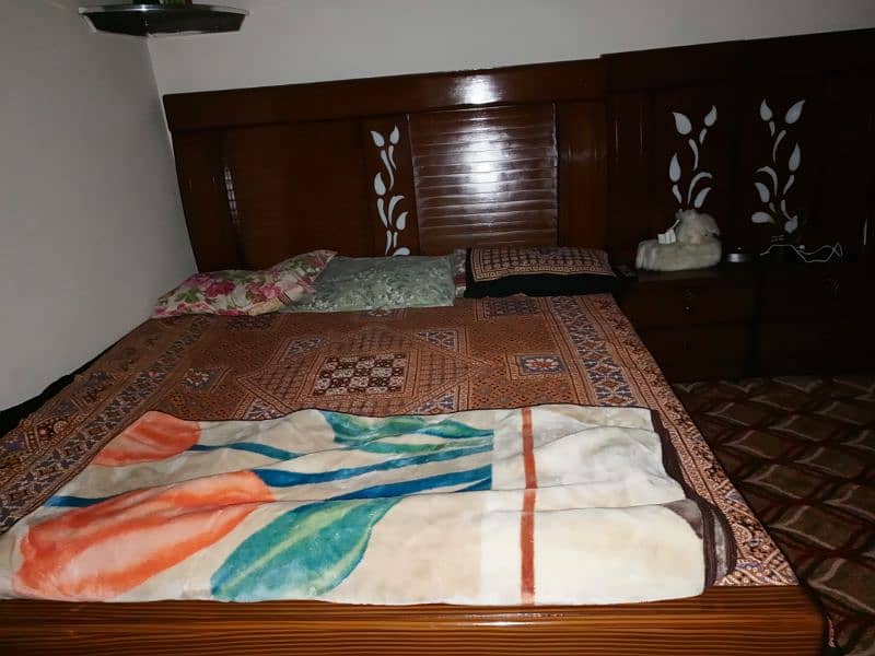 bed with side table and dressing 0