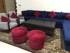 L shape sofa with different items . in very good condition like new.