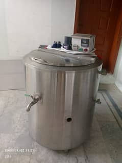 Electric milk boiler.