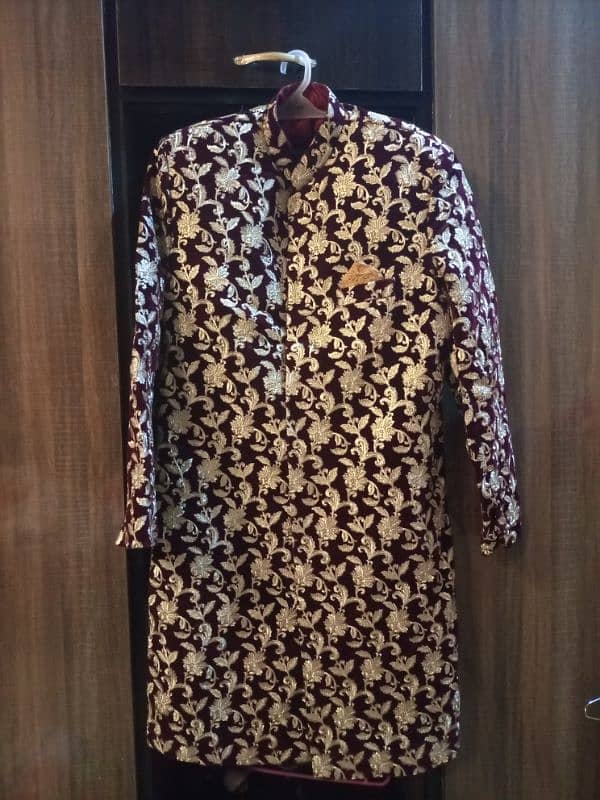 maroon sharwani with gold tilla work 0