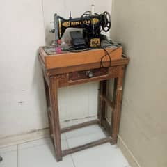 Mushtaq seeing machine with motor and table