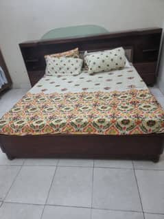 wooden bed in good condition