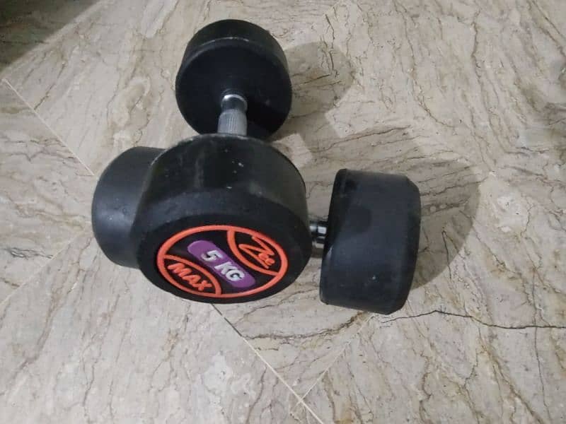 5kgs dumbells pair (5+5) rubber coated and abs roller and chest workou 1