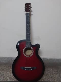 guitar with pick and bag