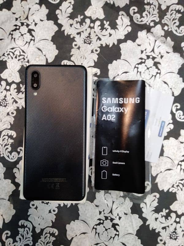 Samsung A02 with box charger 1