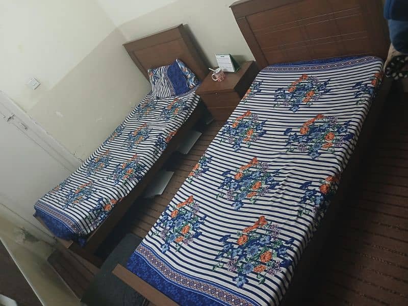 2 single bed sets along with new matresses 3