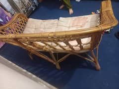 cane sofa with cushions