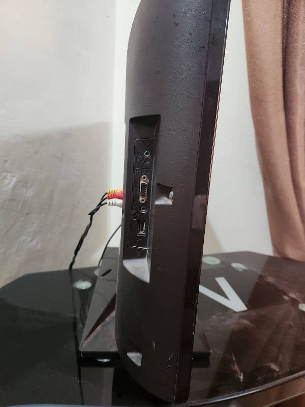 Sony TV with Dish TV Receiver and table. 4