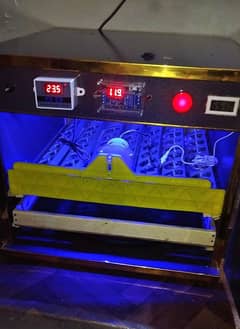 full automatic incubator 56 eggs . . . with heater. . 1 time used only