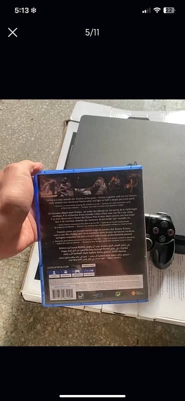 PS4 Slim w original controller and  God of war 4 game 3