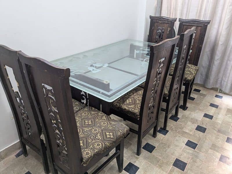 6 seater Wooden Dining table, 6 chairs ,1 glass top Table , 5