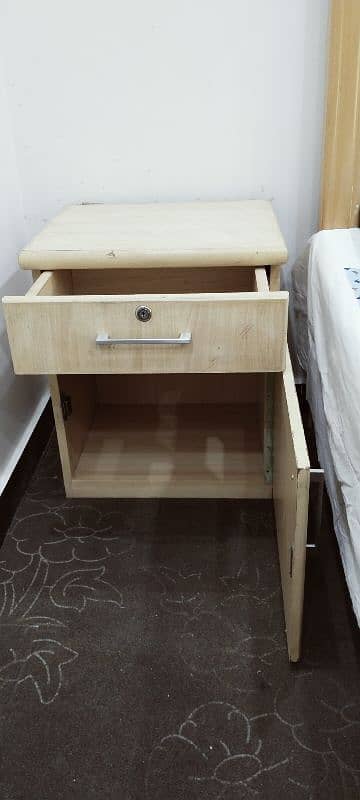 Queen 1 size bed with one side table. 4