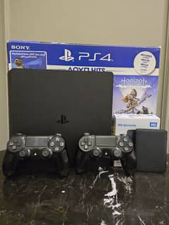 Ps4 Slim 1TB with hard drive 2 controllers 10 games installed