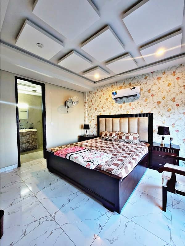 one bed room tv lunch kichan attach bathroom fully luxury furnished apartment available in bahria town Lahore 0