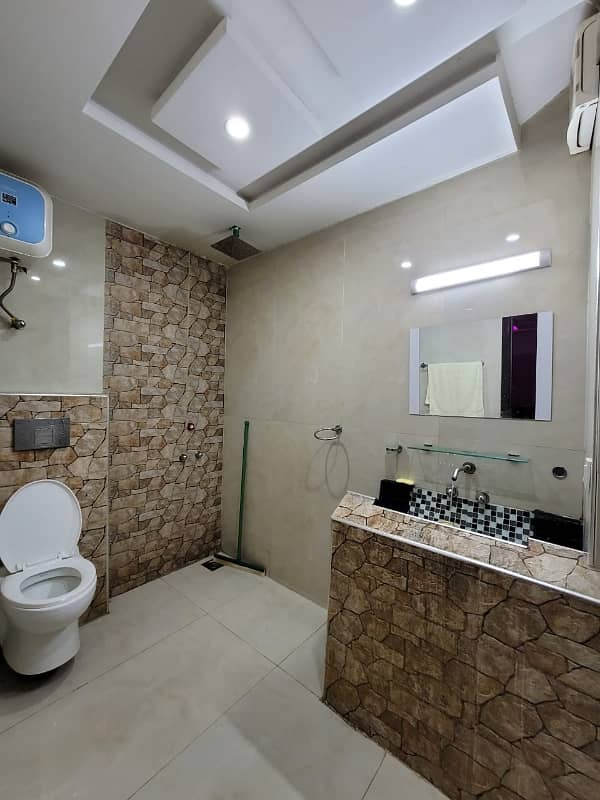 one bed room tv lunch kichan attach bathroom fully luxury furnished apartment available in bahria town Lahore 8