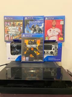 ps4 fat 500gb with 4 games 2 controllers fresh condition