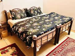 customised 2 iron rods single beds with 2 single mattress