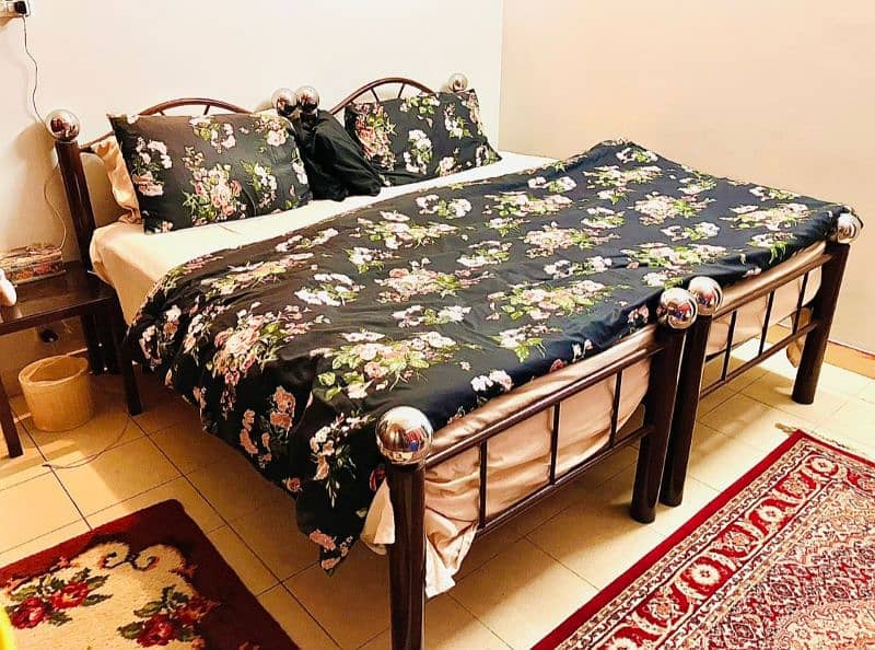 customised 2 iron rods single beds with 2 single mattress 0