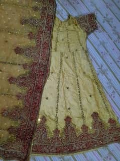 heavy dim golden shirt with heavily embroidered dupatta