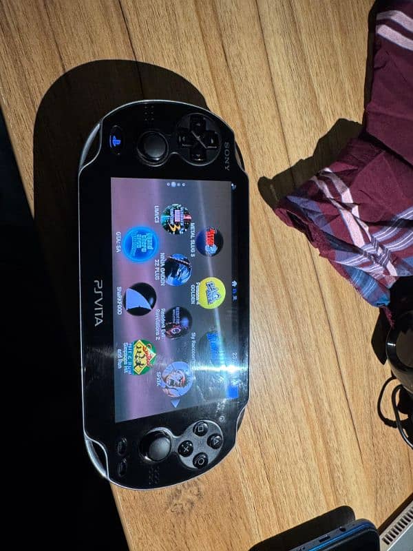 PS Vita OLED model 1000 mint condition with games 6