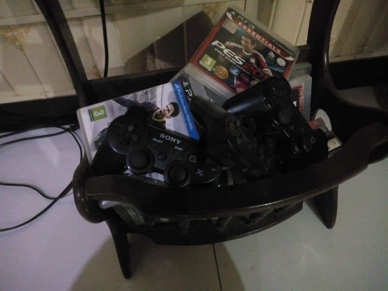 Playstation 3 Slim with 20 plus CD and 3 wireless controllers 2