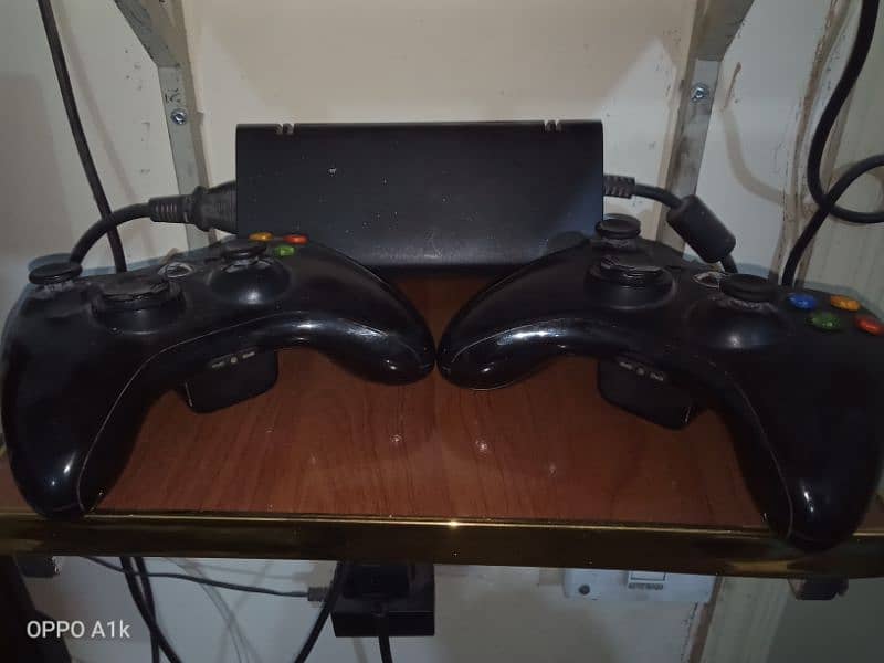 x box 360 slim with original controllers 1