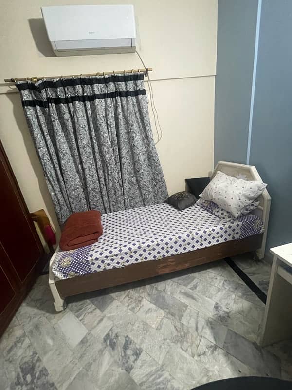 single wooden bed set with side table , wall fitted al mirah 1