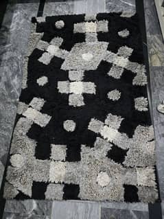 black ,white and grey rug