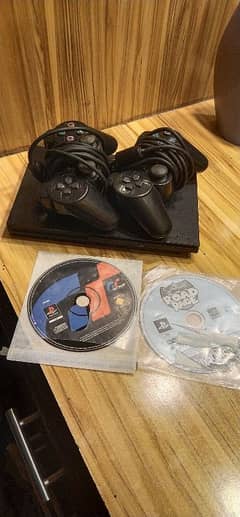 playstation 2 Ultra silm 2 Joystick 40+games 2 CDs