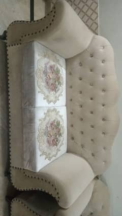 6 seater sofa in white color with flowers designing