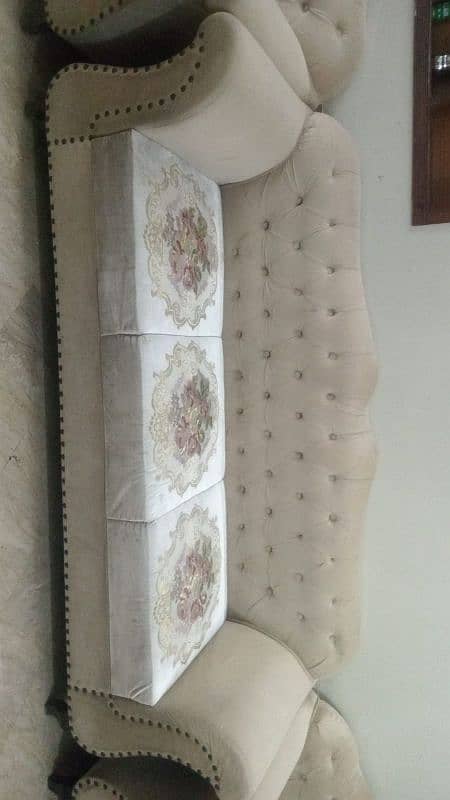 6 seater sofa in white color with flowers designing 1