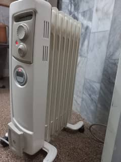 Radiator oil heater