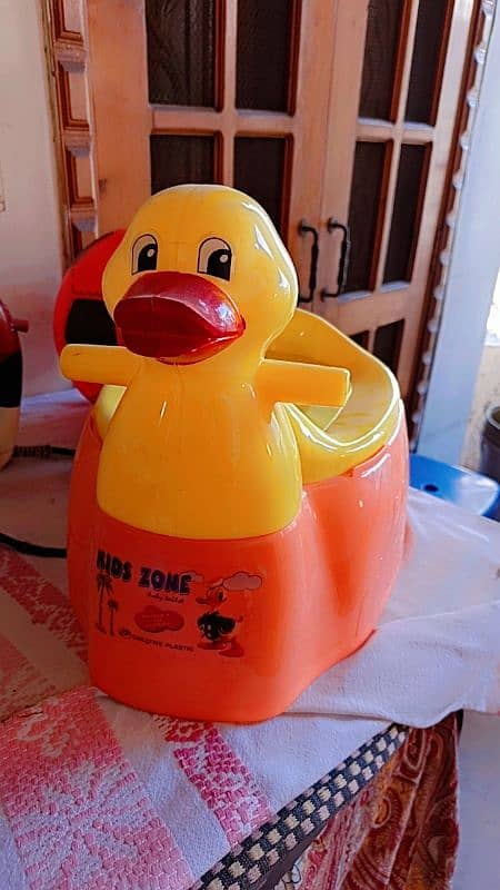 Yellow and peach colour duck baby pott 0