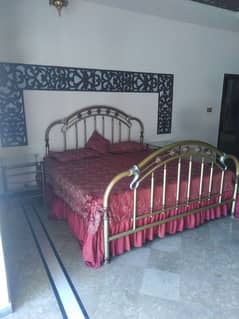 Metal Bed with sidetable and dressing table.