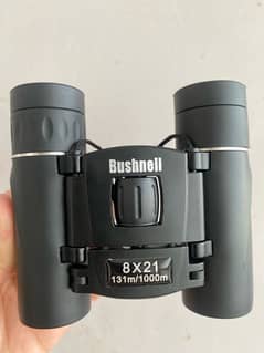 bushnell 8x21 binoculars new condition