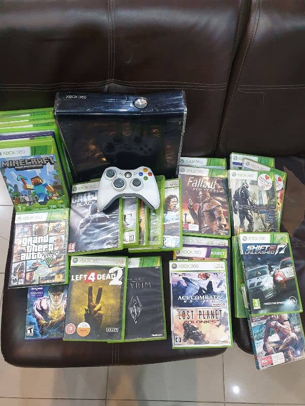 xbox 360 jet black with 30 games 1 wireless controller complete box. 1