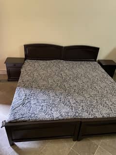 Wooden bed with two sidetables and dressing table