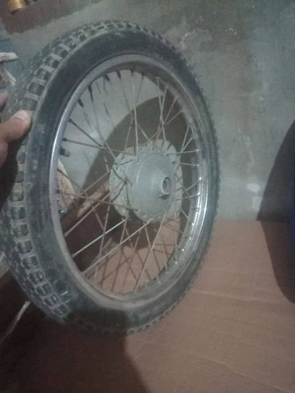 Suzuki 110 front wheel 3