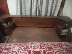 Wooden double bed with showcase